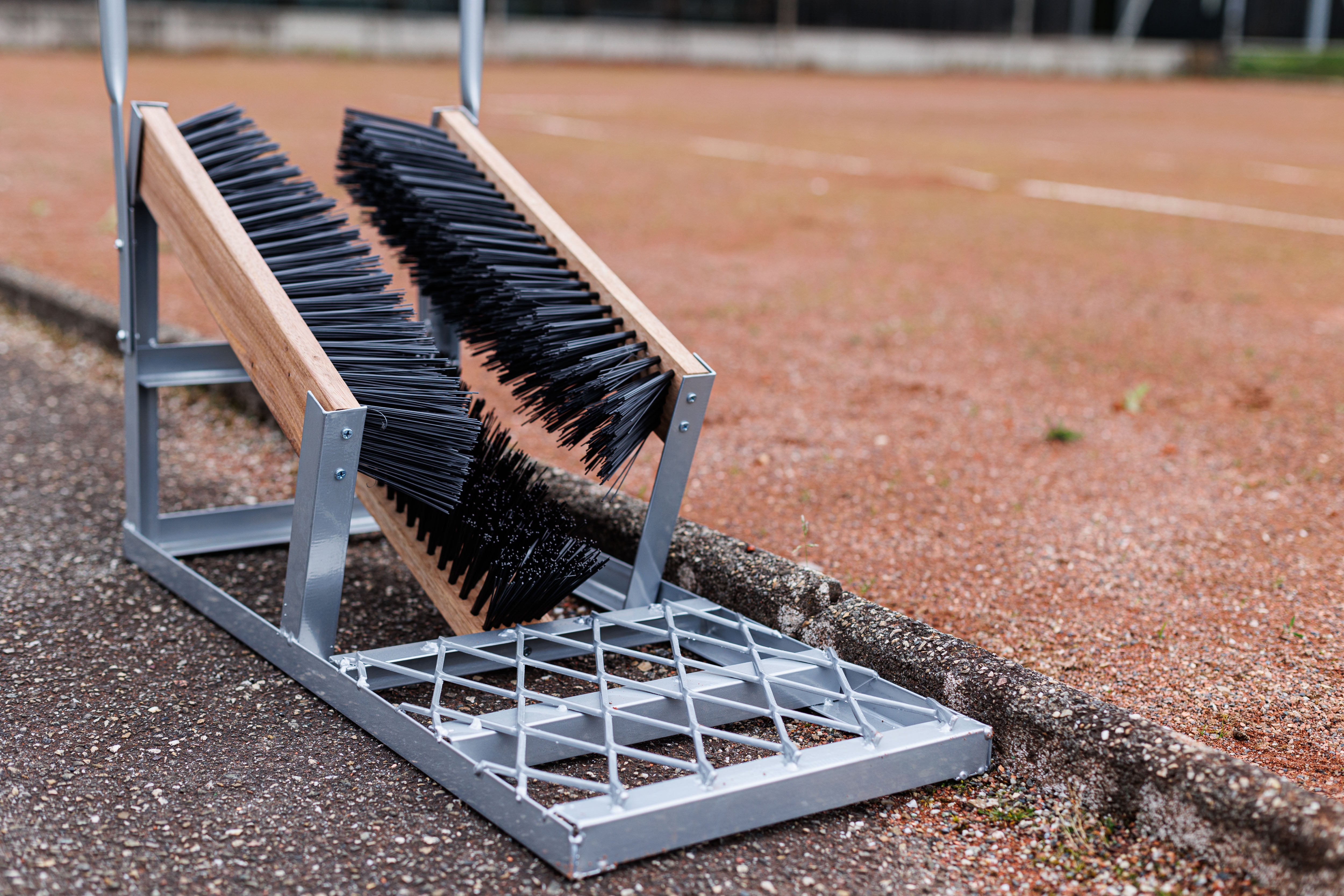 Shoe brush for sports fields with support handle
